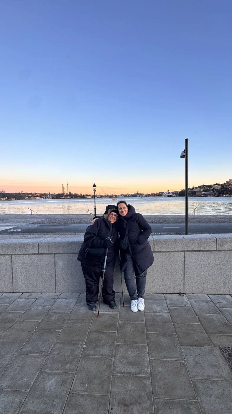 Mariana by the water at sunset with a friend